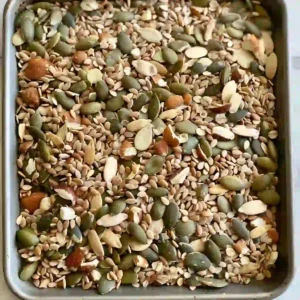 Toasted bariatric seed mix cooling on parchment paper