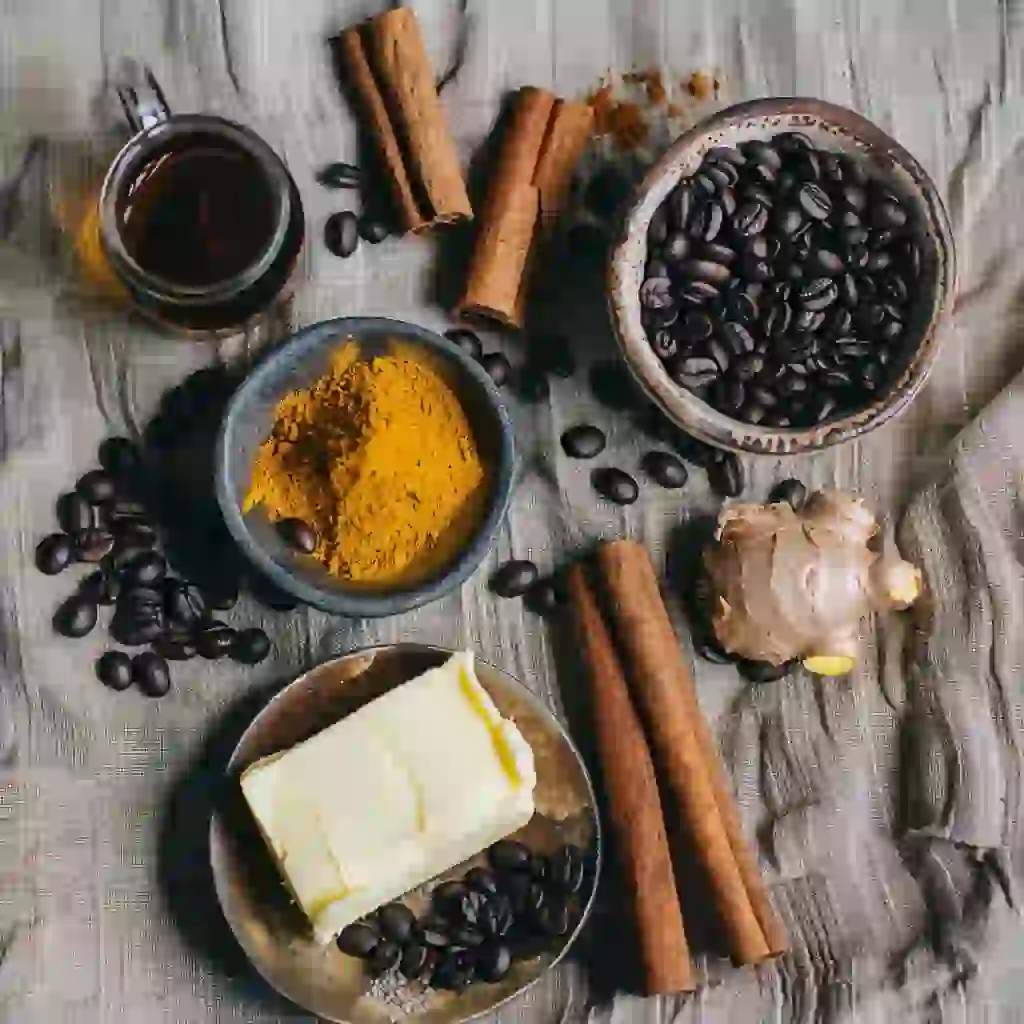 Ingredients for masculinity coffee — coffee beans, turmeric, maca, ginseng, butter, and MCT oil