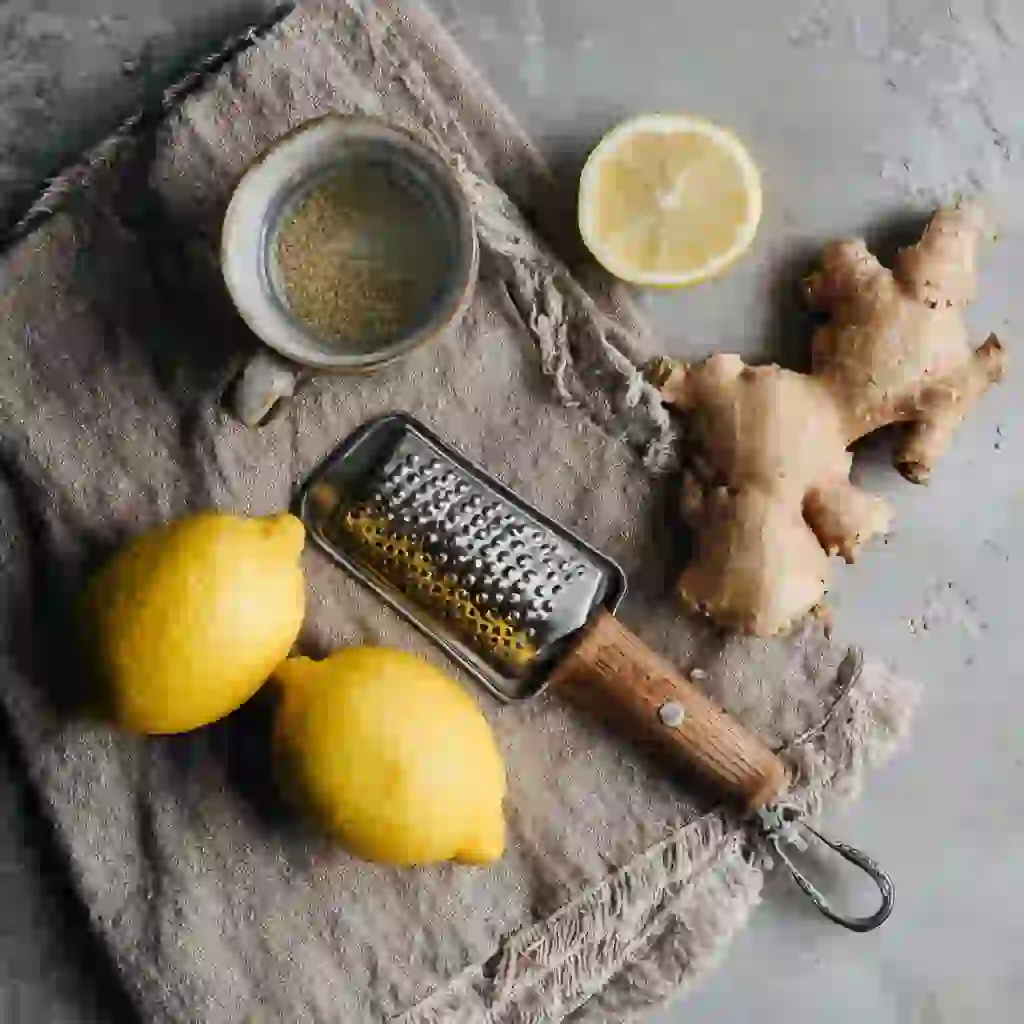 Ginger trick recipe ingredients flat lay – lemon, ginger root, water